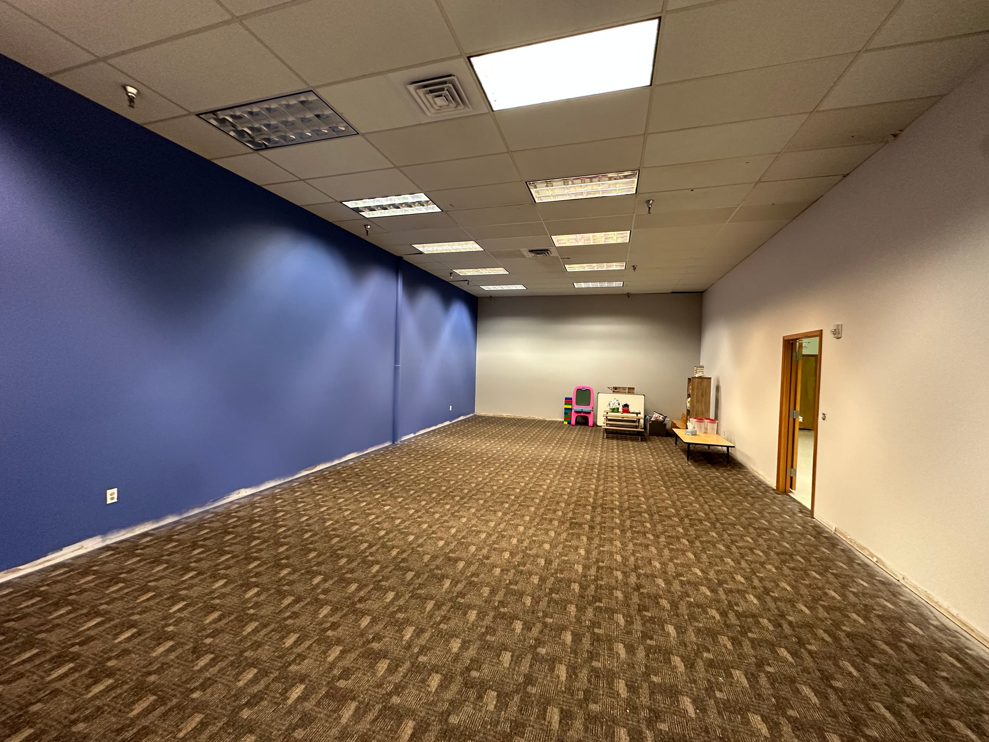 Blue accent drywall after commercial painting in a Spokane, WA office suite